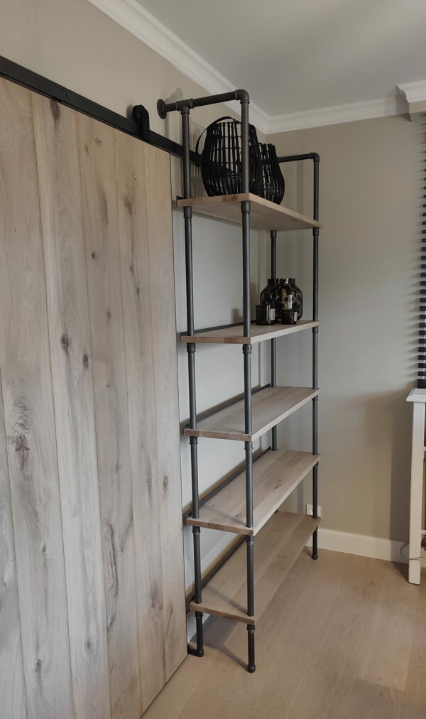 Industrial-style plumbing pipe cabinet with integrated sliding door.